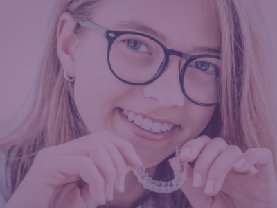 Girl with clear aligner - Invisalign vs ClearCorrect